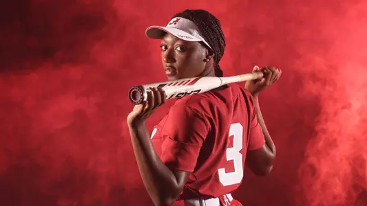 Kristen White posing with a bat