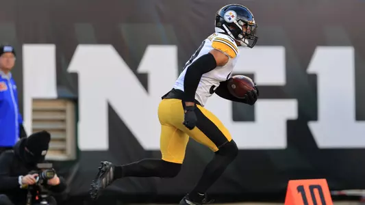 Pittsburgh Steelers free safety Minkah Fitzpatrick (39) runs with the ball after making an interception against the Cincinnati Bengals during the first half of an NFL football game, Sunday, Nov. 28, 2021, in Cincinnati. (AP Photo/Aaron Doster)