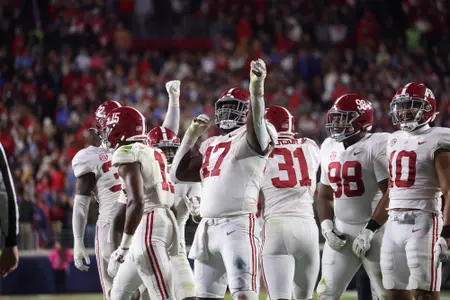 Alabama defensive lineman Byron Young (47) shoots an arrow of celebration against Ole Mississippi at Vaught-Hemingway Stadium in Oxford, MS on Saturday, Nov 12, 2022.