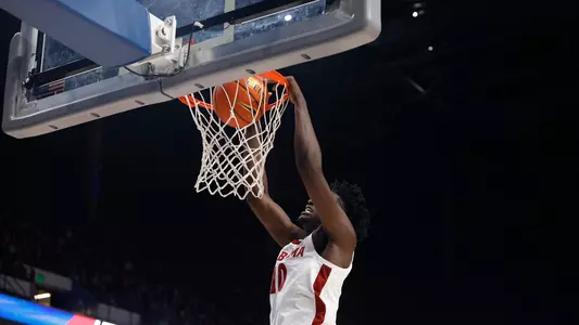 Charles Bediako dunking the ball