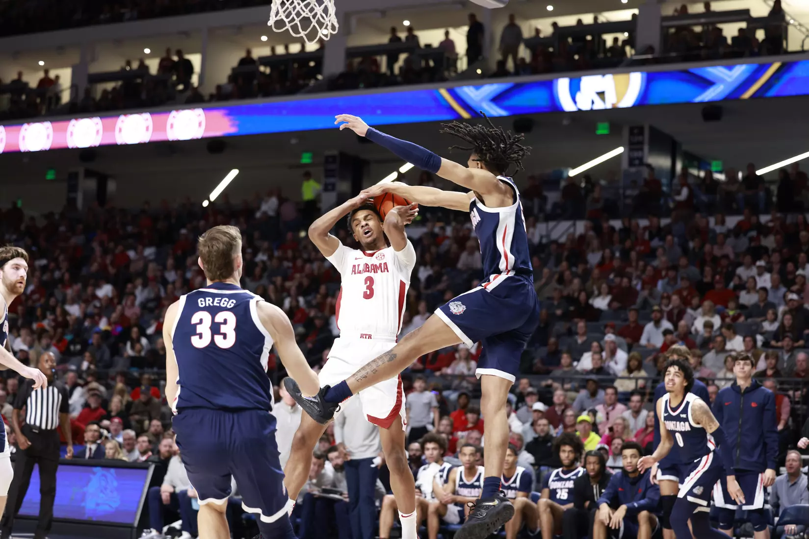 Alabama Guard Rylan Griffen (3) fights for a rebound against Gonzaga at Legacy Arena in Birmingham, AL on Saturday, Dec 17, 2022.