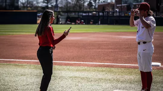 Brock Guffey being interviewed on the edge of the field