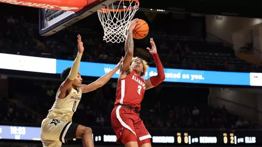 JD Davison pulls down the rebound