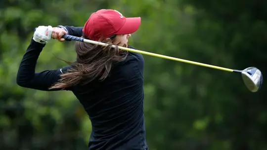 Emma Talley swinging the golf club