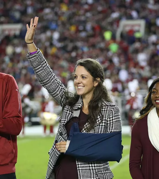Emma Talley waving at the championship ring presentation