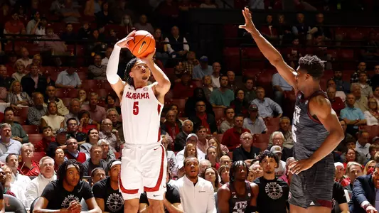 Shackelford shoots a three