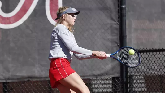 Anna Parkhomenko returning a serve