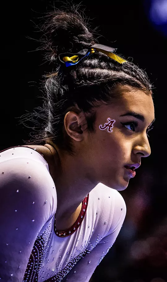 Closeup of Luisa Blanco preparing to get on the balance beam