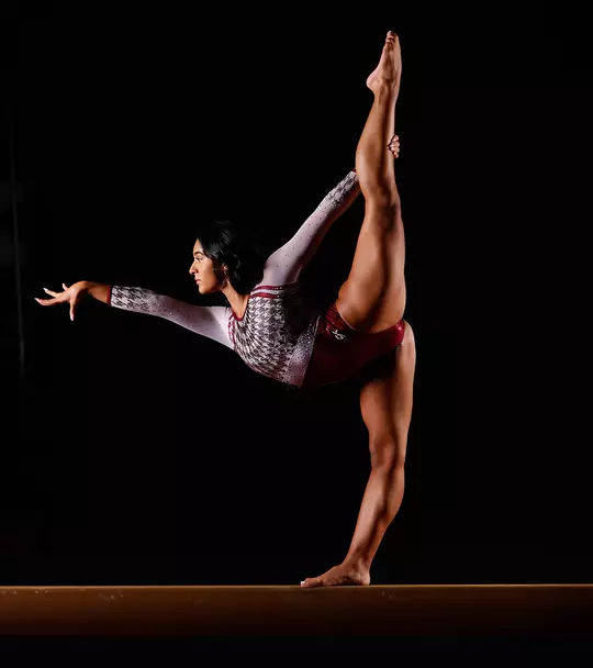 Luisa Blanco posed on one leg on the balance beam