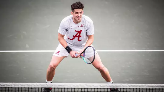 Juan Martin standing behind the net