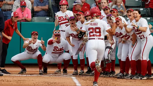 Alabama softball celebrating an Ashley Prange home run