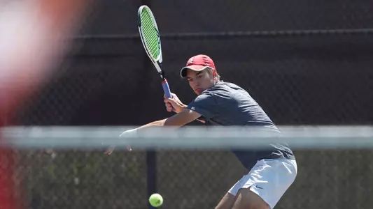 Filip Planinsek places a shot over the net