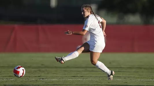Kate Henderson kicking the ball