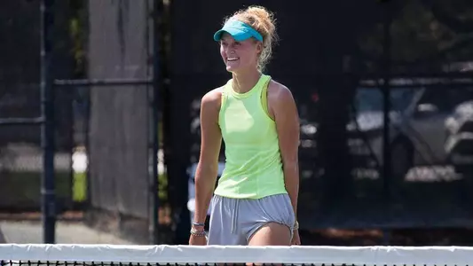 Erin Routliffe smiles on tennis court