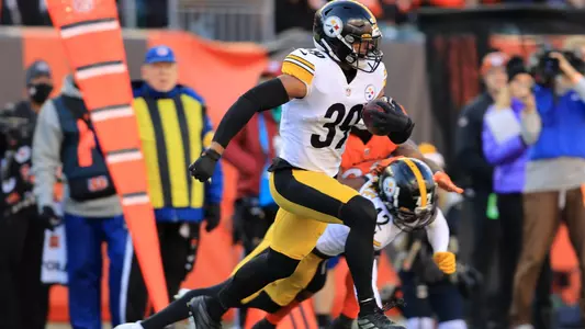 Pittsburgh Steelers free safety Minkah Fitzpatrick (39) runs with the ball after making an interception against the Cincinnati Bengals during the first half of an NFL football game, Sunday, Nov. 28, 2021, in Cincinnati. (AP Photo/Aaron Doster)