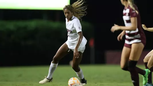 Gianna Paul dribbes the ball