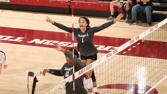 Alabama volleyball player Micah Gryniewicz celebrating getting a point.