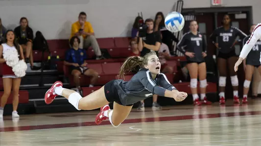 Alabama volleyball player Katie Shook diving for the ball.