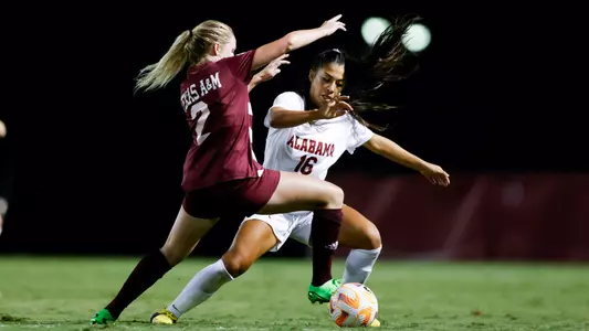 Reyes cuts around a defender
