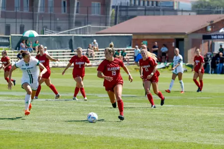 Ashlynn Serepca dribbling against Utah Valley
