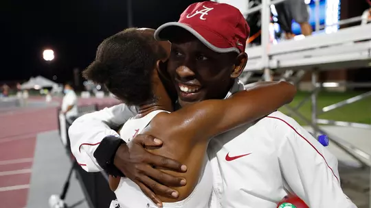 Mercy Chelangat and Vincent Kiprop hugging after a race