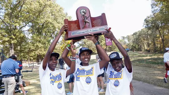 Mercy Chelangat and teammates holding up the 2022 National Championship trophy