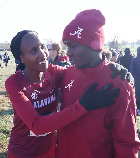 Mercy Chelangat with her arms around Vincent Kiprop