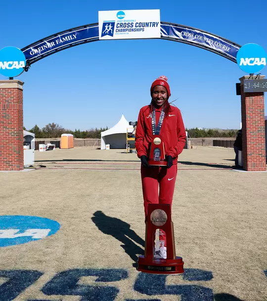 Mercy Chelangat posing with the trophy for the 2022 Cross Country National Championship