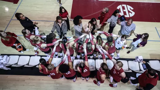 Alabama volleyball team breaks huddle at the bench during a timeout vs. Missouri (Oct. 11, 2023)