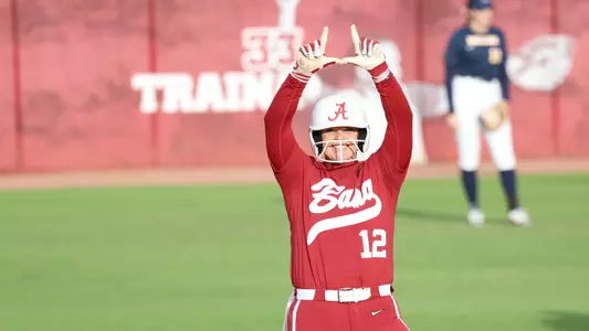 Emma Broadfoot celebrates a hit on second base.