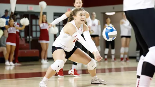 Lily Hopkins digging the ball.