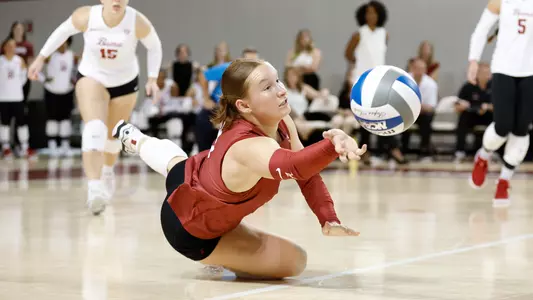 Victoria Schmer lays out and saves the ball.