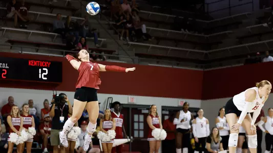 Victoria Schmer serves the ball.
