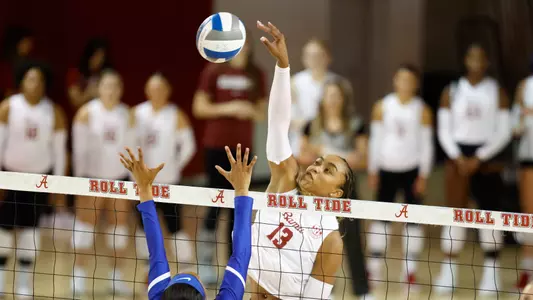 Alyiah Wells hits the ball.