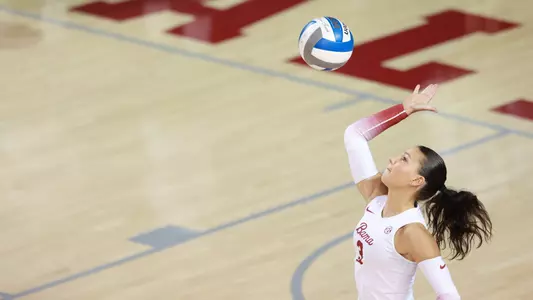 Allison Berent serves the ball.