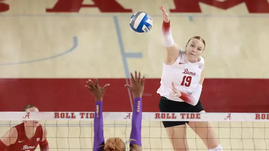 Kendyl Reaugh hits the ball over the LSU block.
