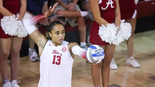Alyiah Wells focuses before a serve.