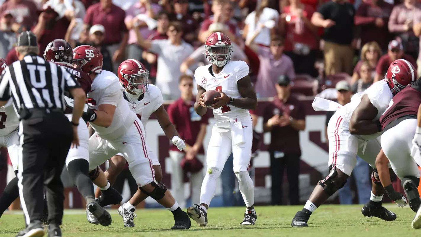 Alabama quarterback Jalen Milroe (4) takes the snap against Texas A&M at Kyle Field in College Station, TX on Saturday, Oct 7, 2023.