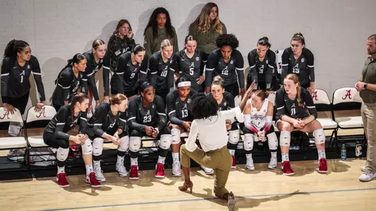 Alabama volleyball players on the bench during a timeout vs. Arkansas (Nov. 10, 2023)