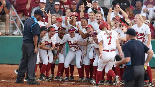 Bailey Dowling celebrates with her teammates at home after a home run vs. Florida State (Feb. 19, 2023)