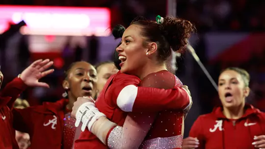 Makarri Doggette hugging one of her teammates