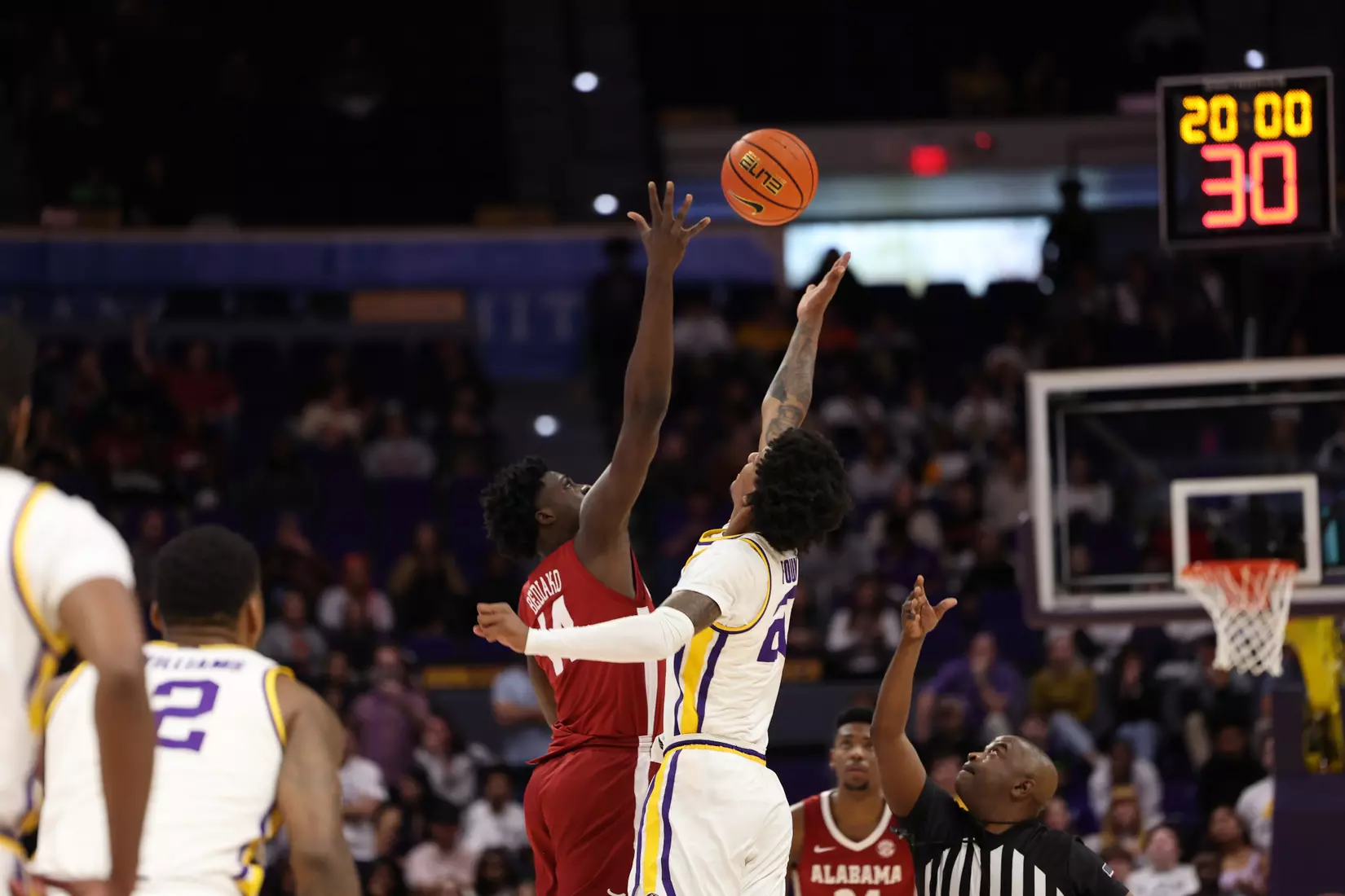 Alabama Center Charles Bediako (14) tips off against LSU at Pete Maravich Center in Tuscaloosa, AL on Saturday, Feb 4, 2023.