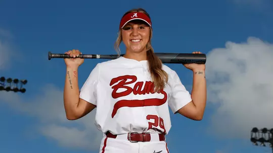 Ashley Prange holding a bat across her shoulders