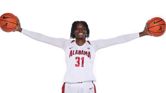 Naomi Jones holds basketballs