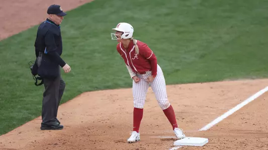 Bailey Dowling celebrates at third base against Arkansas (March 18, 2023)