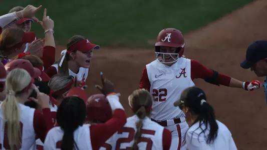 Kali Heivilin celebrates at home plate after a home run vs. UAB (Feb. 22, 2023)