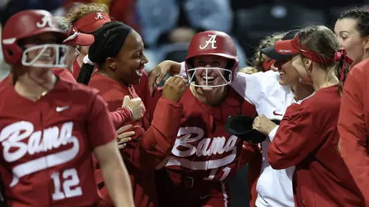 Larissa Preuitt celebrates with the team after a grand slam at Missouri (March 31, 2023)