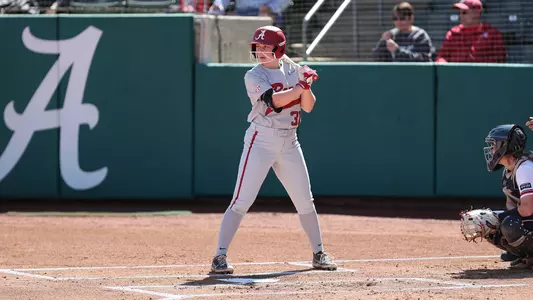 Alabama softball player Kenleigh Cahalan bats on base.