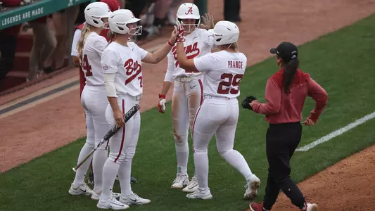 Ashley Prange high fives teammates after scoring a run vs. South Carolina (April 8, 2023)