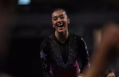 Luisa Blanco celebrates after uneven bars routine